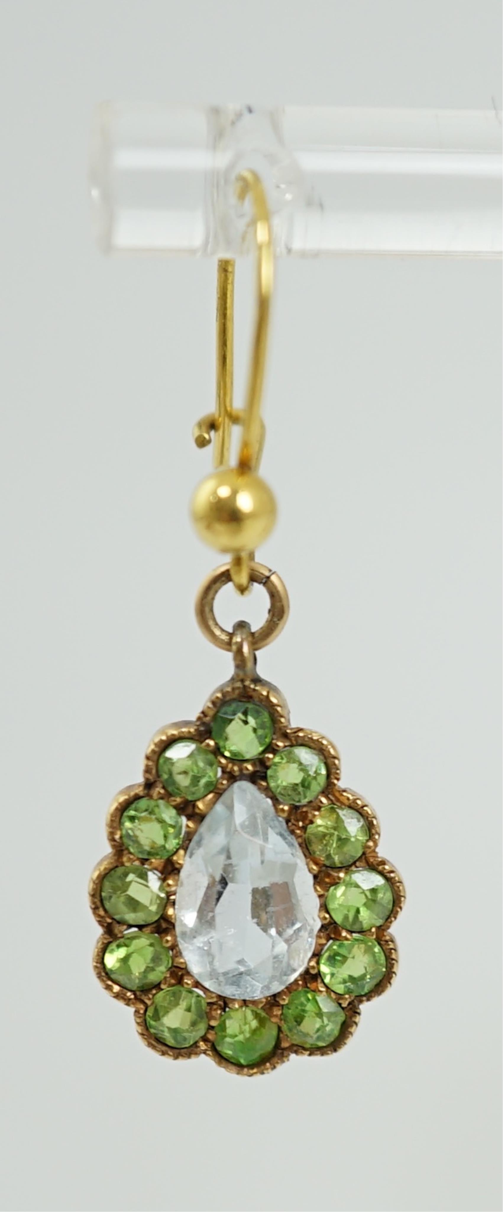 A pair of late Victorian yellow metal, aquamarine and demantoid garnet cluster set pear shaped drop earrings